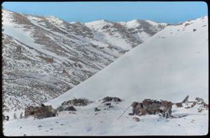 Image of Iglus [igloos] (winter homes of Polar Eskimos - Rocks for meat)